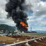 pexels-photo-26952062-26952062 Intense factory fire causing thick black smoke and bright flames in an industrial district.